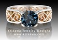 Modern Infinity Engagement Ring in Rose Gold with Teal Blue Sapphire